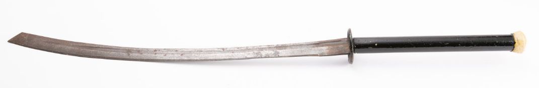 A Burmese dha, the curved fullered blade