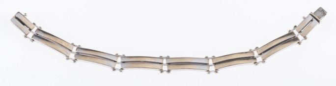 A double bar link bracelet, with push-in clasp, marked 585, length approx.19.2cm, 18.