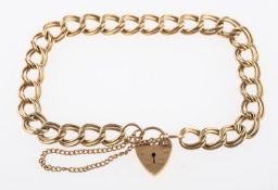 A 9ct yellow gold double link bracelet, with heart padlock and safety chain, UK hallmark,