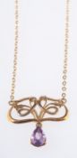 A 9ct yellow gold 'Art Nouveau' style necklace set with a pear-shaped amethyst drop, length 38.