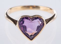 A heart shaped ring, collet set with a heart-shaped amethyst, marked 9ct, size Q, 2.8grams.
