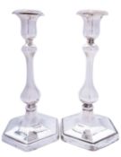 A pair of Edward VII silver candlesticks by Charles & George Asprey, London 1907, of hexagon form,