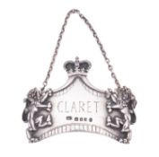 A silver wine label by Leslie Durbin, London 1953 (coronation mark),