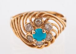 An Egyptian style ring, a high openwork twisted setting, claw set with a blue stone cabochon,