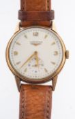 Longines a 9ct gold gentleman's wristwatch the round cream dial signed Longines and having raised