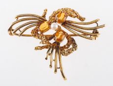 A 9ct yellow gold vintage brooch, set with three oval-cut citrines and a cultured pearl,