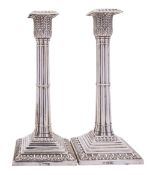 A pair of Edward VII silver candlesticks, maker's marks rubbed, Sheffield 1902,