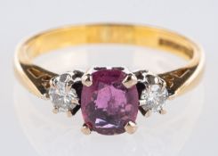 An 18ct yellow gold three stone ring,