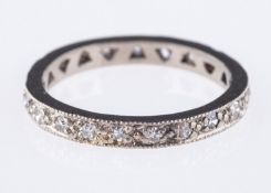 A full eternity ring, set with twenty-one single-cut diamonds in a milgrain setting,diamonds approx.