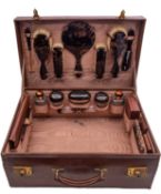 A George V leather, faux tortoiseshell and silver lady's vanity case by D C Bs, London 1929,
