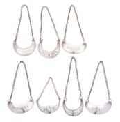 Seven silver crescent wine labels, three Scottish, mark of Newlands & Grierson of Glasgow,