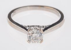 An 18ct white gold solitaire ring set with a central brilliant-cut diamond, 0.