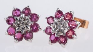 A pair of 9ct yellow & white gold stud earrings,