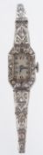 A diamond inset cocktail watch the rectangular silvered dial with black Roman numerals,