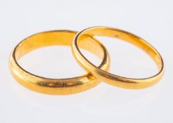 Two 22ct yellow gold wedding bands, both UK hallmarked, sizes M1/2 and M, total gross weight 6.