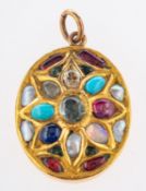 An ornate oval designed pendant,