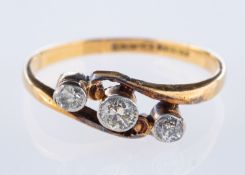 A three stone ring, collet set with old European cut diamonds, diamonds approx. 0.