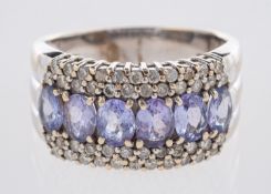 A tanzanite and diamond ring, a five row ring,