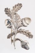 Geoffrey G Bellamy, for Ivan Tarratt, a silver acorn & foliage designed brooch, signed to verso,