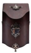 A George III mahogany serpentine fronted knife box with silver handles, lock and feet,