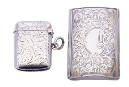 A Victorian silver vesta case by E T, Birmingham 1900, of concave rectangular form,
