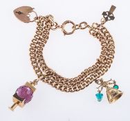 A charm bracelet with three charms, a double-row curb bracelet with heart padlock,