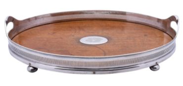 An early 20th century oak and silver plated gallery tray, not marked, raised on bun feet, 51.