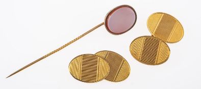 A pair of cufflinks and a stick pin,