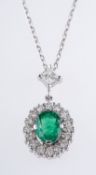 An emerald and diamond pendant and chain,