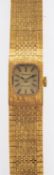 Tissot Stylist, a lady's gold-plated wristwatch with integral bark-finish bracelet,
