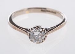 A solitaire ring, set with a brilliant-cut diamond in an eight claw illusion style setting,