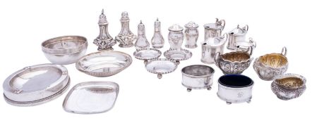 A group of silver cruet sets and other items comprising: four silver mustard pots,