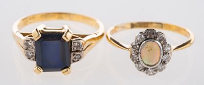 A group of two rings, to include a cluster ring set with an opal cabochon,
