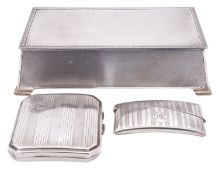A George VI silver cigarette box by Spiers & Wordsworth, Birmingham 1934, of rectangular form,
