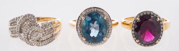 Three 9ct yellow gold rings, including a cluster ring set with an oval-cut garnet,