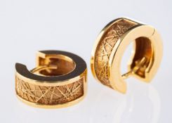 A pair of hoop earrings, with a polished and textured finish, marked 750, 7.1grams.