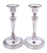 A pair of Elizabeth II silver candlesticks by Payne & Son, London 1963,