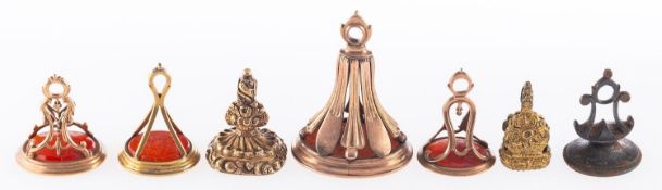 A group of hardstone fob seals, including five carnelian set fob seals, unmarked, tests as 9ct,