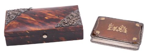 A white metal, tortoiseshell and yellow