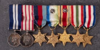 A WWII DSM miniature group of seven , DS