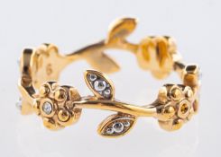 A flower and foliate design band, set wi
