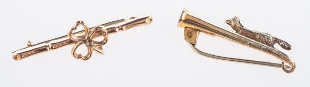 Two brooches, a hunting horn & fox brooc
