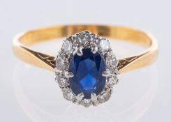 A cluster ring, set centrally with an ov