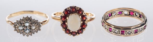 A group of three rings, including a 9ct