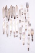 A group of silver fish knives and forks,
