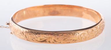 A 9ct rose gold bangle, a hinged bangle