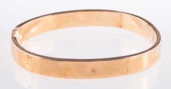 A flat edged bangle, a hollow hinged ban
