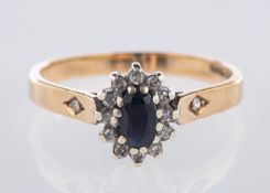 A 9ct yellow gold cluster ring, centrall