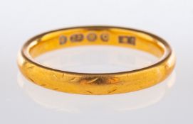 A 22ct yellow gold wedding band, UK hall