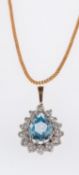 A blue topaz pendant, set with a pear-sh